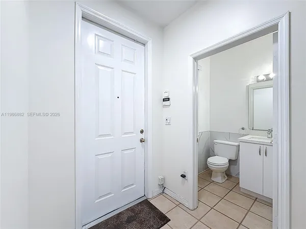 a bathroom with a granite countertop sink