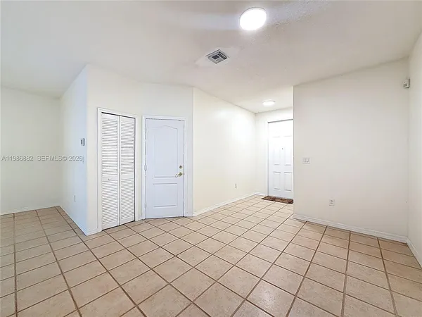 a view of an empty room and window