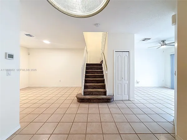 a view of an entryway with a chandelier
