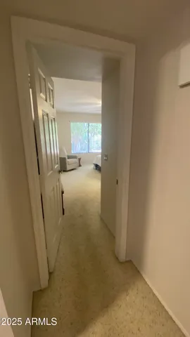 a bedroom with bed and window