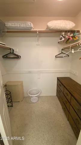a spacious bathroom with a granite countertop sink and a mirror