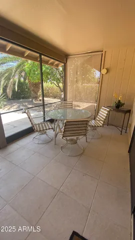 a lobby with furniture and floor to ceiling window