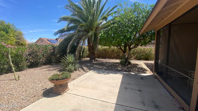 a view of a backyard of the house