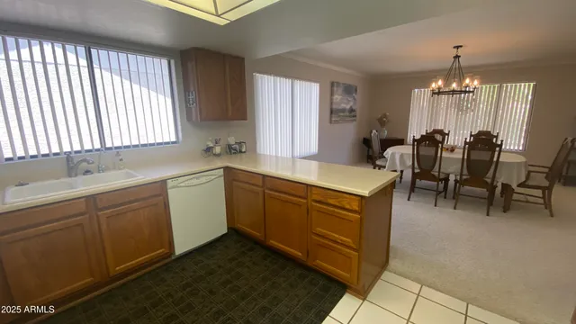 a kitchen with stainless steel appliances a refrigerator and a counter space