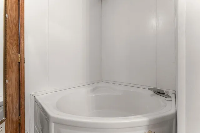 a bedroom with bunk bed and a desk