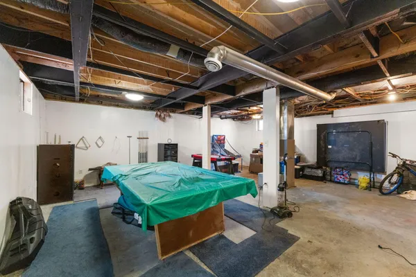 a view of a terrace with furniture and a backyard