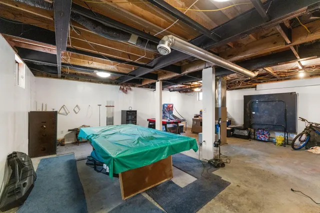 a view of a terrace with furniture and a backyard