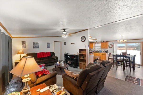 a dining room with furniture and wooden floor