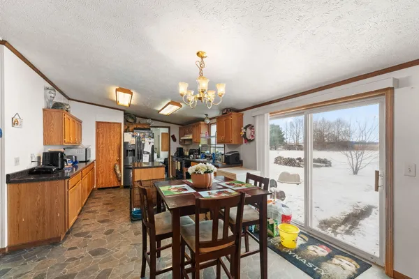 a kitchen with stainless steel appliances granite countertop sink stove top oven and cabinets