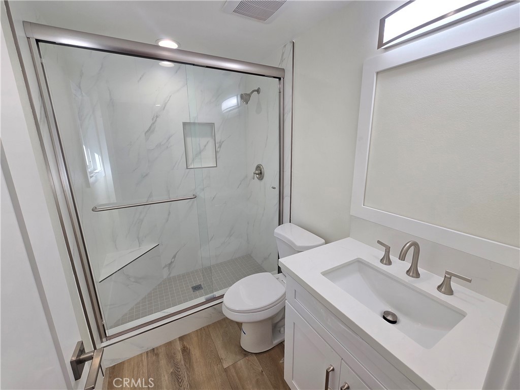 34516 Via Verde Dana Point, CA 92624 - Photo 13 of 15 a bathroom with a shower sink vanity and toilet