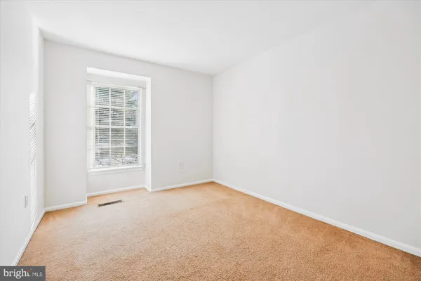 a bathroom with a toilet sink a mirror and shower
