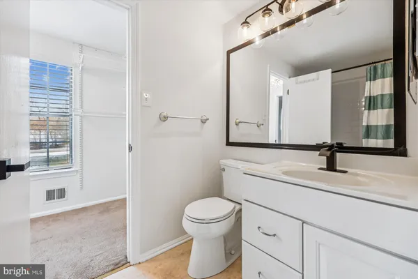 a kitchen with stainless steel appliances a refrigerator sink and microwave