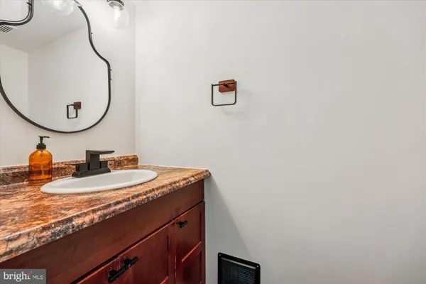 a room with a bed and wooden floor