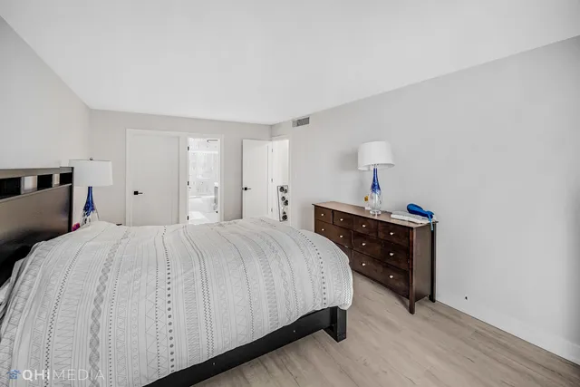 a bedroom with a bed and a closet