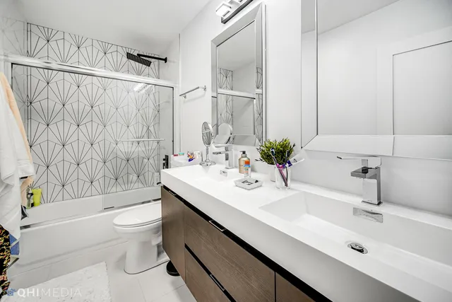 a bathroom with a sink a toilet and a bathtub