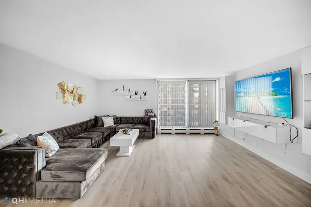 a dining room with furniture a rug and wooden floor