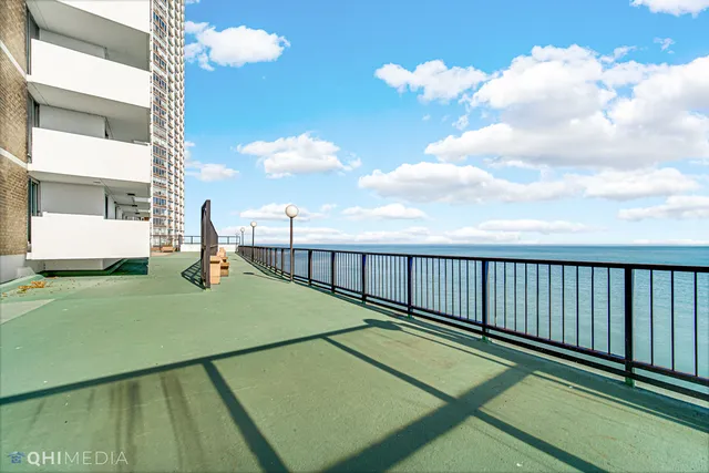 an outdoor space with pool and furniture