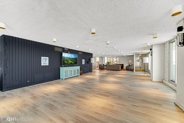 a view of a hallway with a chandelier
