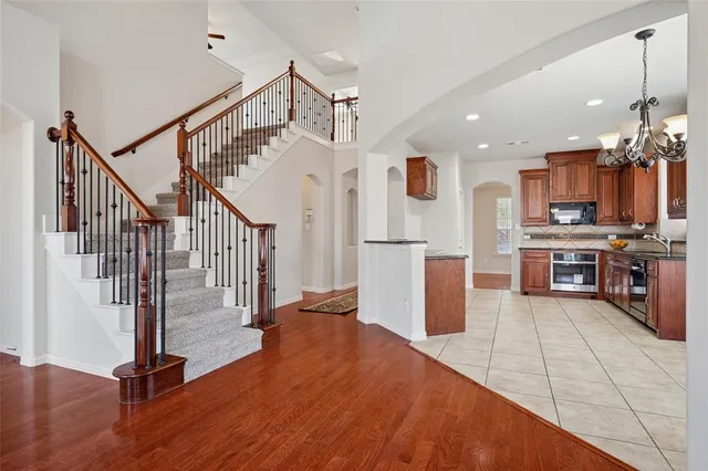 a view of kitchen with stainless steel appliances kitchen island microwave and stove