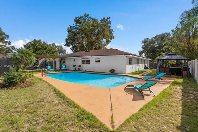 swimming pool with outdoor seating