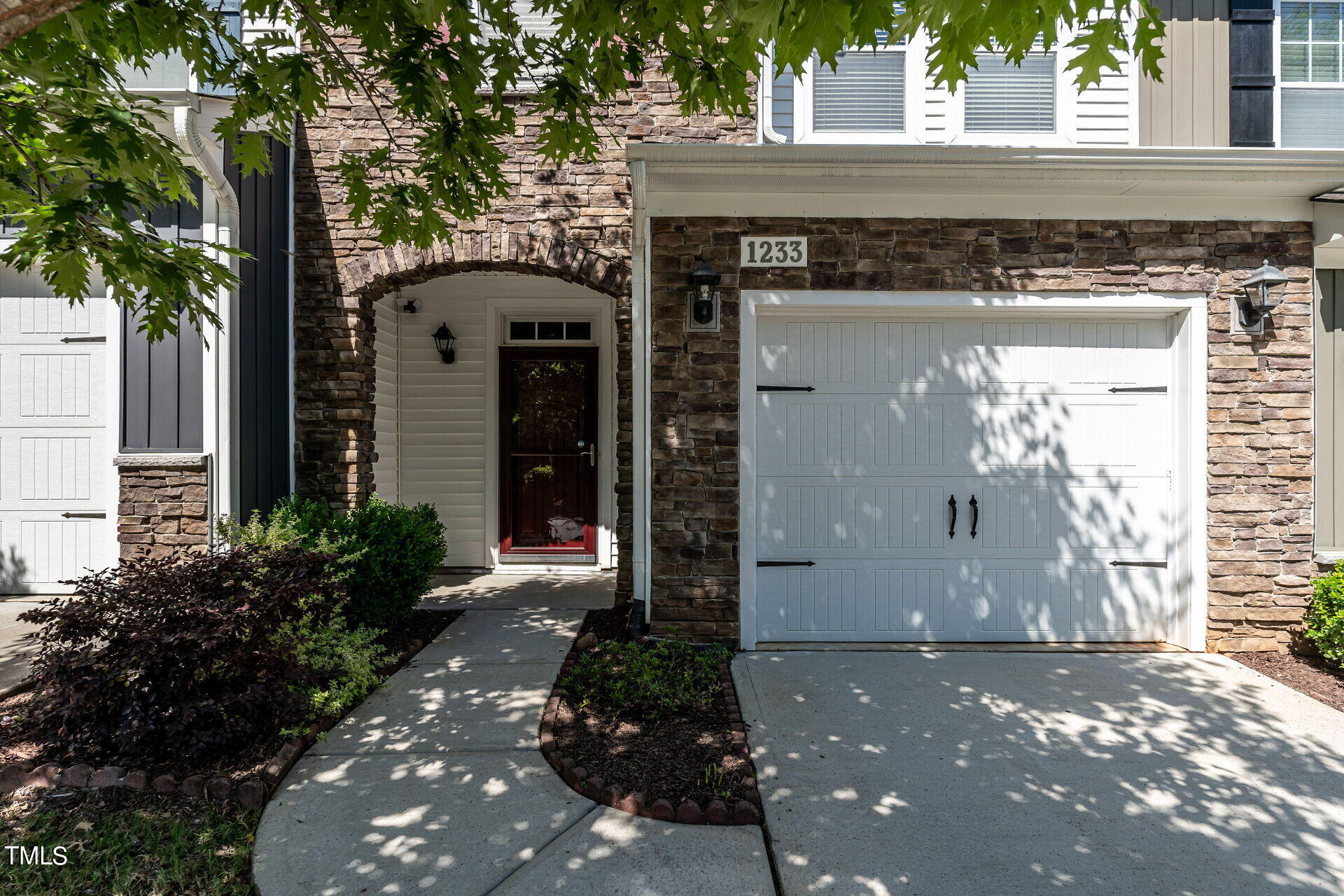 1233 Silver Beach Way Raleigh, NC 27606 - Photo 3 of 26 a front view of a house with a yard