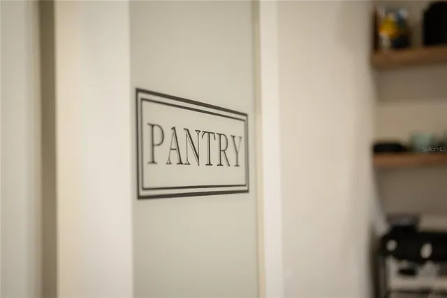 a living room with fireplace furniture and a flat screen tv