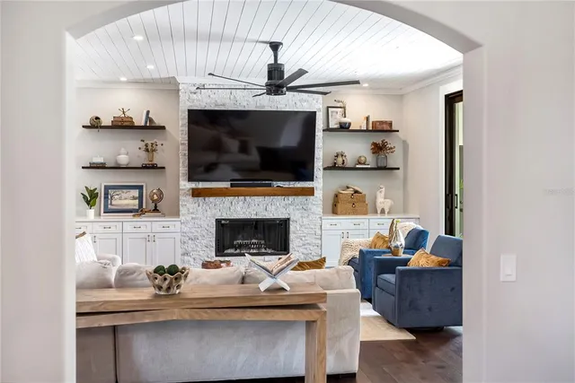 a bathroom with a double vanity sink a toilet a mirror and shower