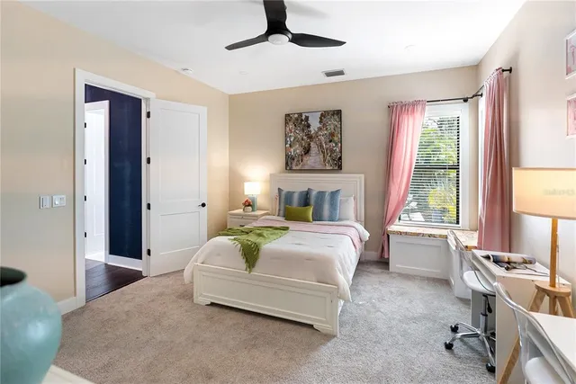 a view of a house with swimming pool and furniture