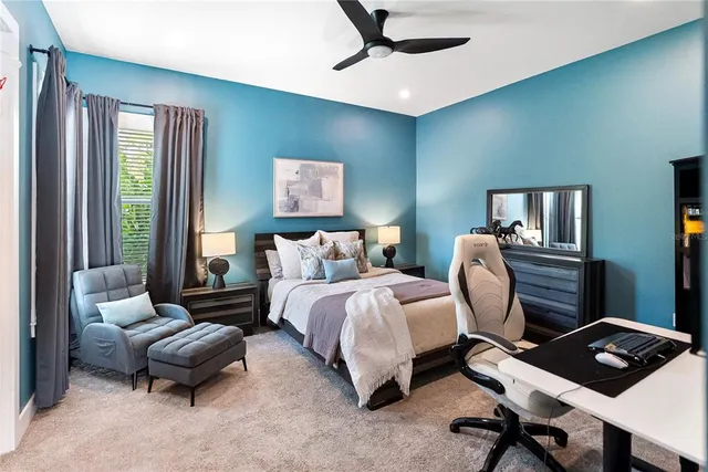 a view of a house with backyard and a tree