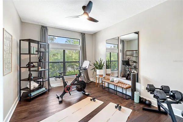 a view of a livingroom with workspace and a window