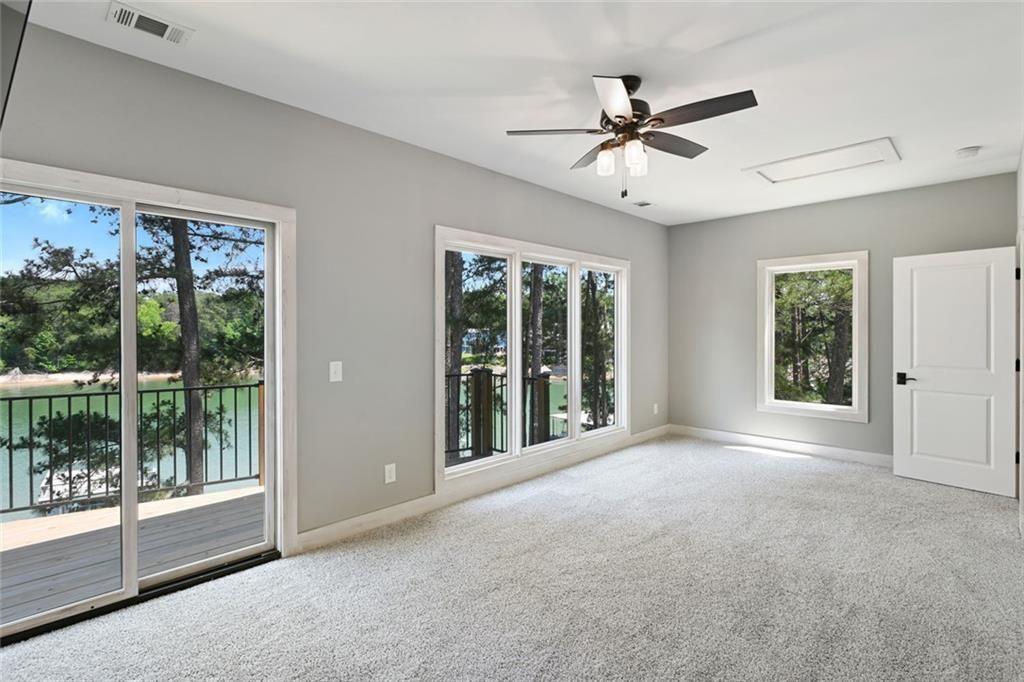 2040 Ridge Road Cumming, GA 30041 - Photo 31 of 52 a view of a livingroom with a ceiling fan and window