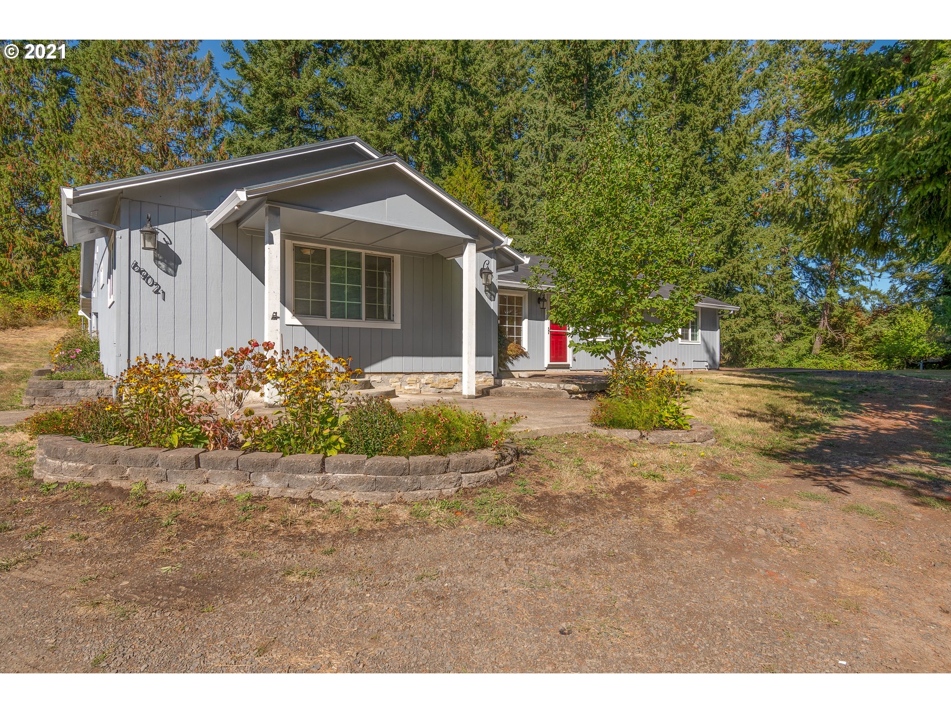 69021 Nicolai Road Rainier, OR 97048 - Photo 1 of 32 a front view of a house with a yard