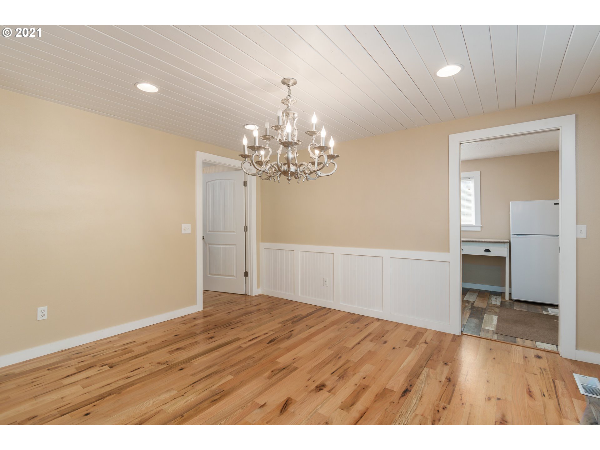 69021 Nicolai Road Rainier, OR 97048 - Photo 11 of 32 a view of a room with wooden floor and chandelier