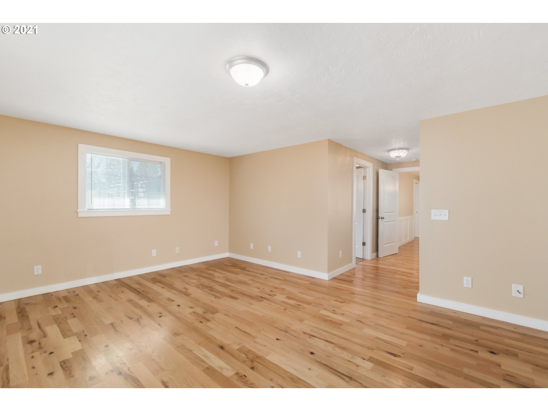 69021 Nicolai Road Rainier, OR 97048 - Photo 13 of 32 a view of an empty room with wooden floor and a window