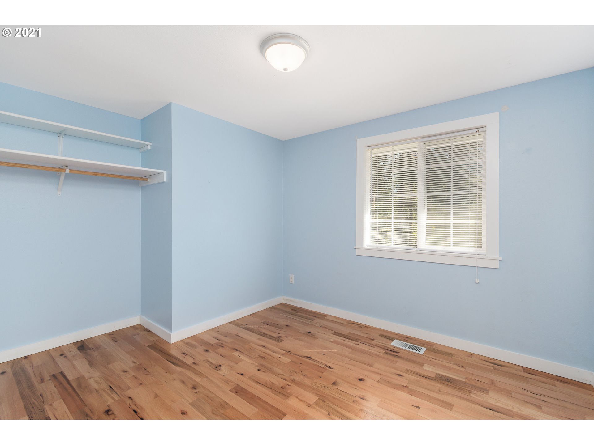 69021 Nicolai Road Rainier, OR 97048 - Photo 15 of 32 a view of an empty room with wooden floor and a window