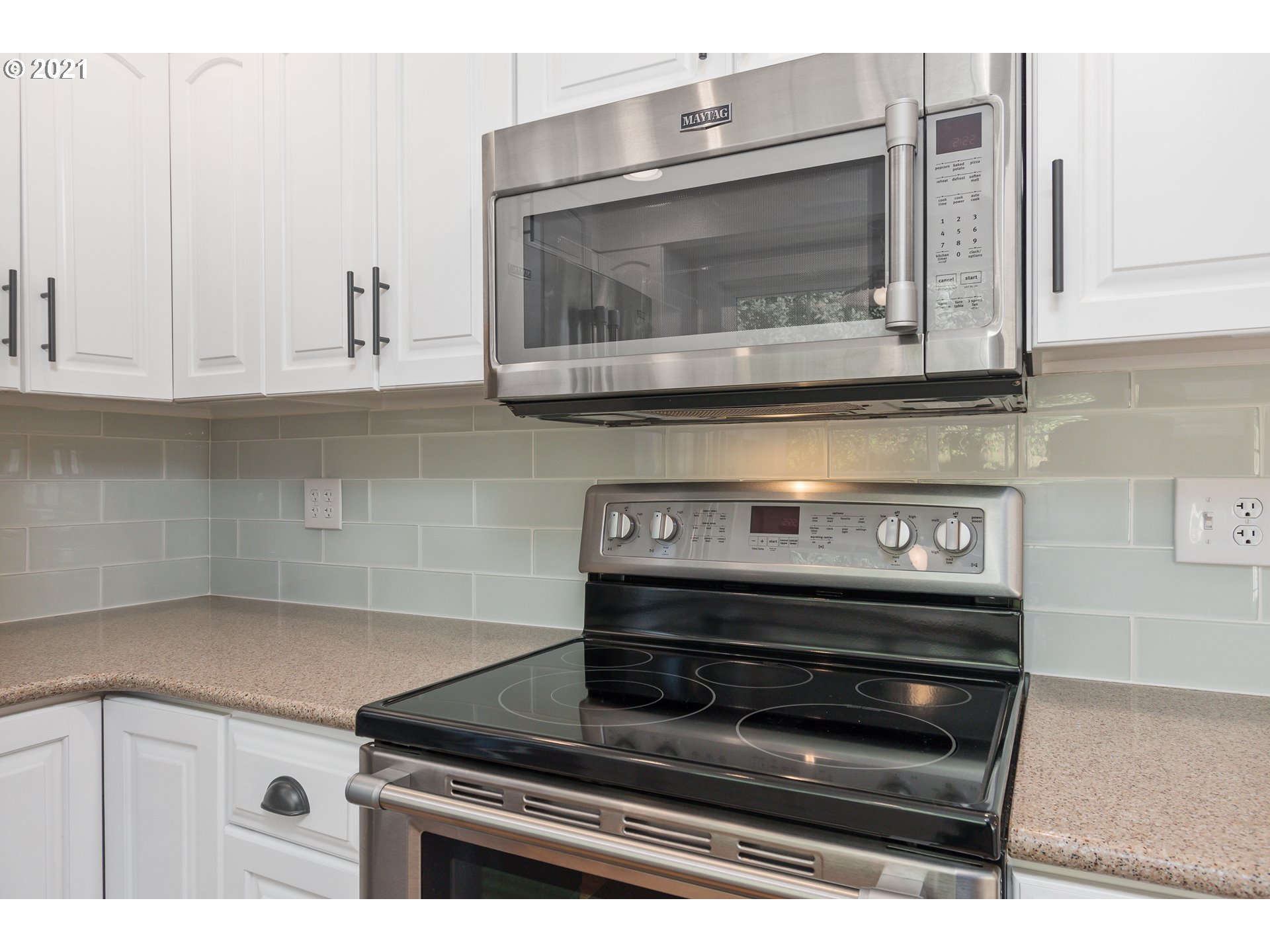 69021 Nicolai Road Rainier, OR 97048 - Photo 9 of 32 a stove top oven sitting inside of a kitchen