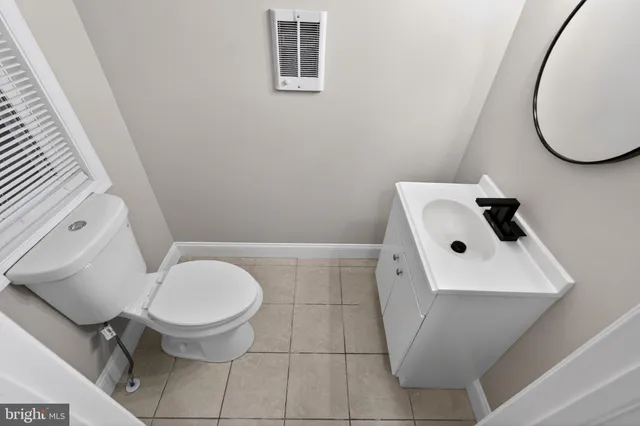 a bathroom with a toilet and a sink