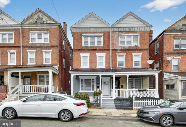 a car parked in front of a house