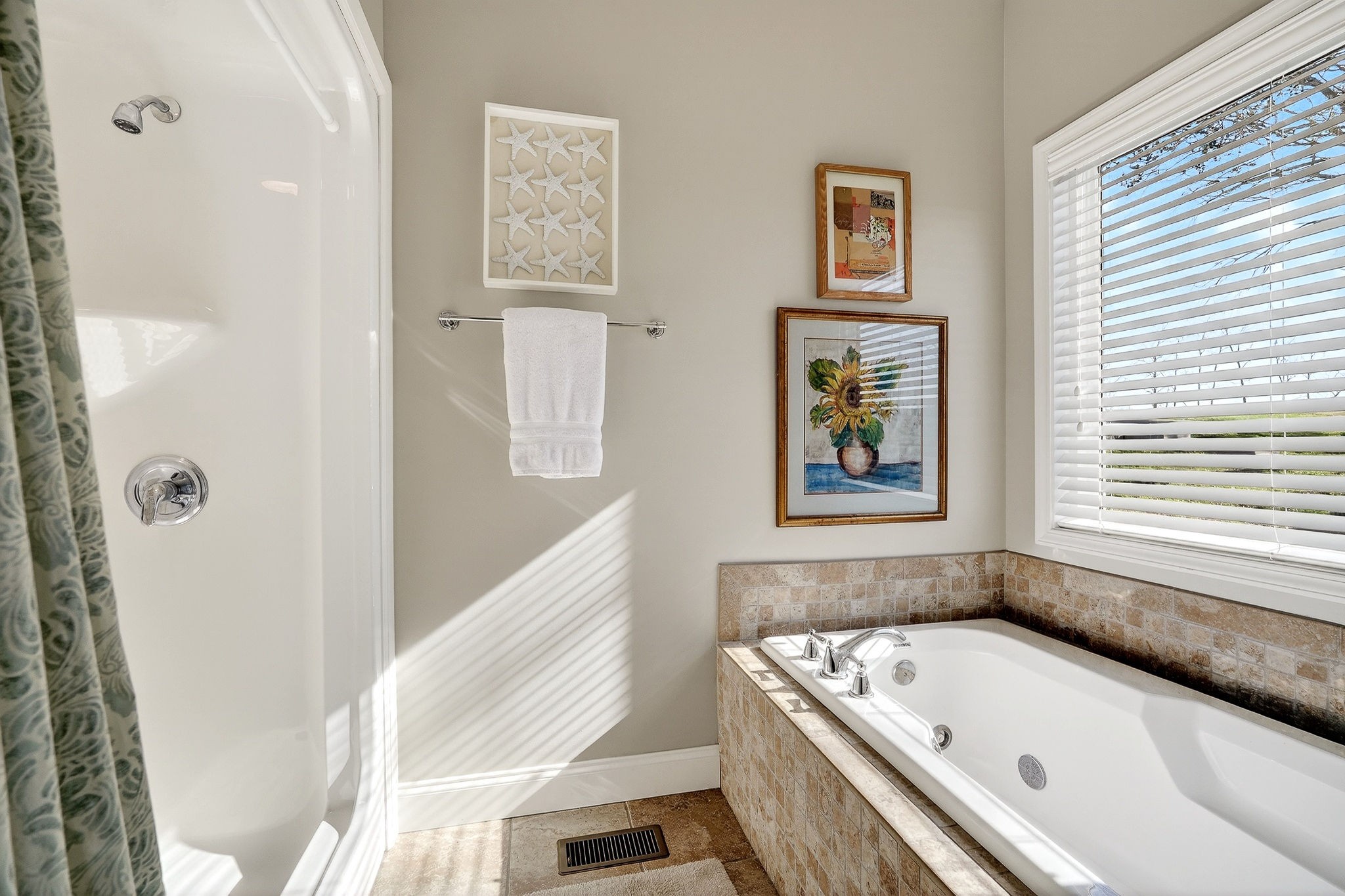 1175 Hutchins Bend Road Sparta, TN 38583 - Photo 33 of 76 a bathroom with a tub a sink and a window
