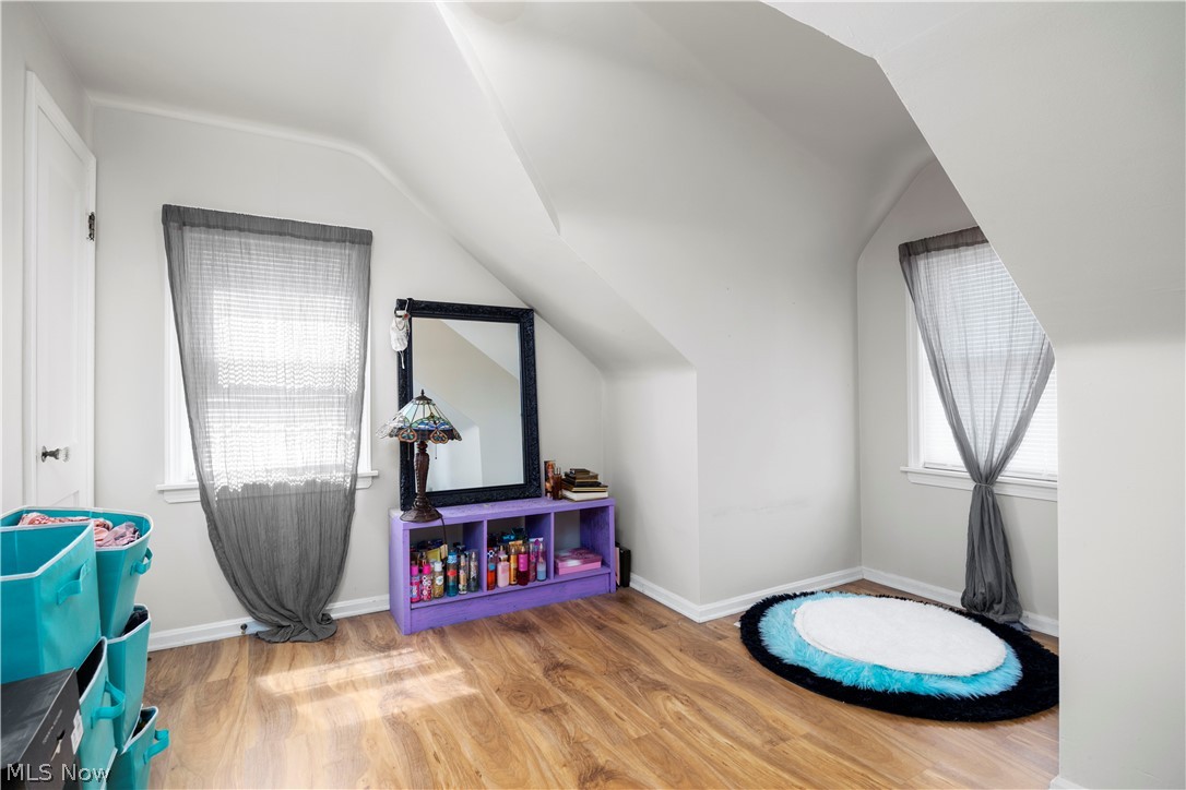 3305 Warren Road Cleveland, OH 44111 - Photo 5 of 28 Rec room featuring vaulted ceiling and light wood-type flooring