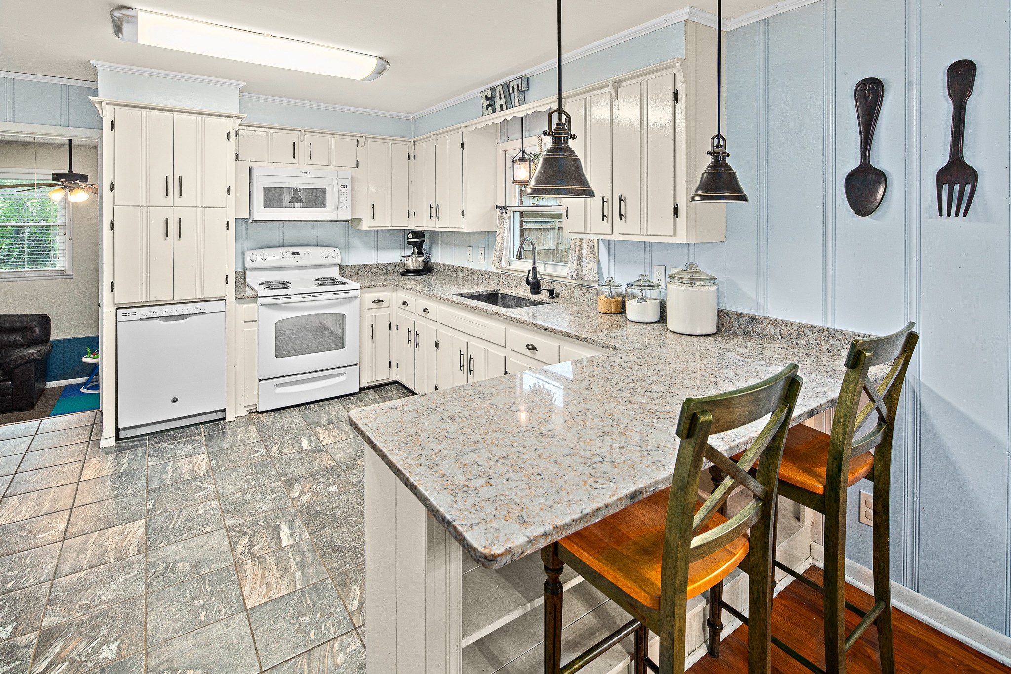 9161 Versailles Road Rockvale, TN 37153 - Photo 13 of 32 a kitchen with stainless steel appliances granite countertop a sink dishwasher and cabinets with wooden floor