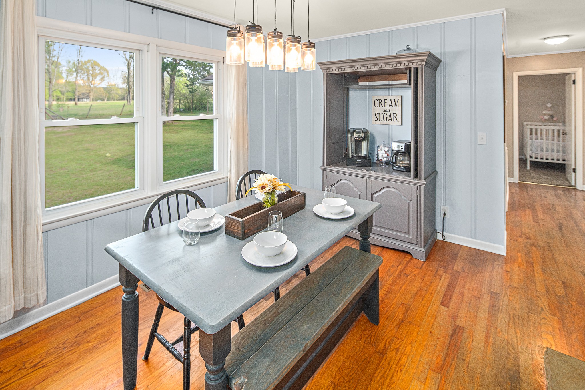9161 Versailles Road Rockvale, TN 37153 - Photo 16 of 32 a view of a dining room with furniture window and wooden floor