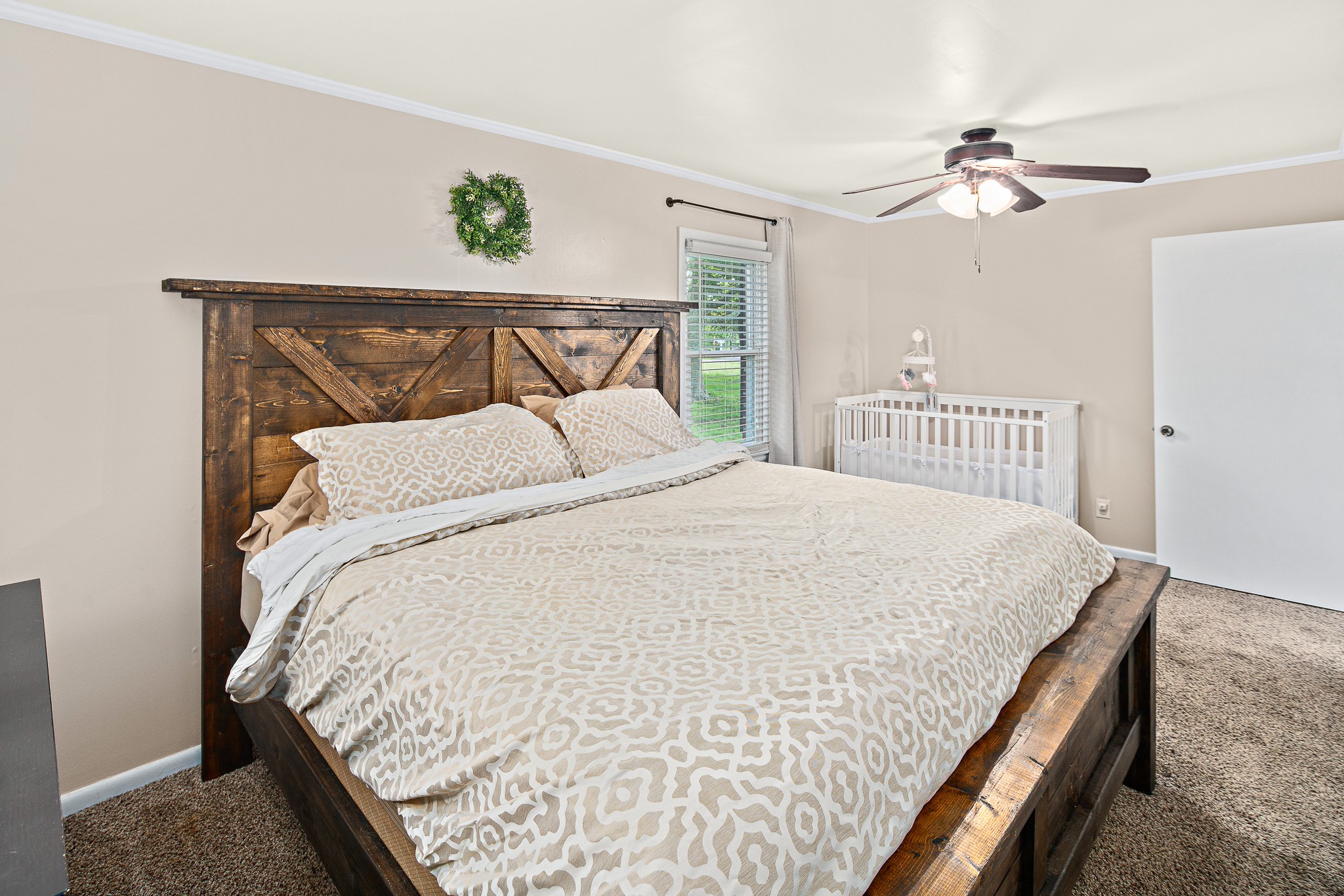 9161 Versailles Road Rockvale, TN 37153 - Photo 17 of 32 a bedroom with a bed and ceiling fan