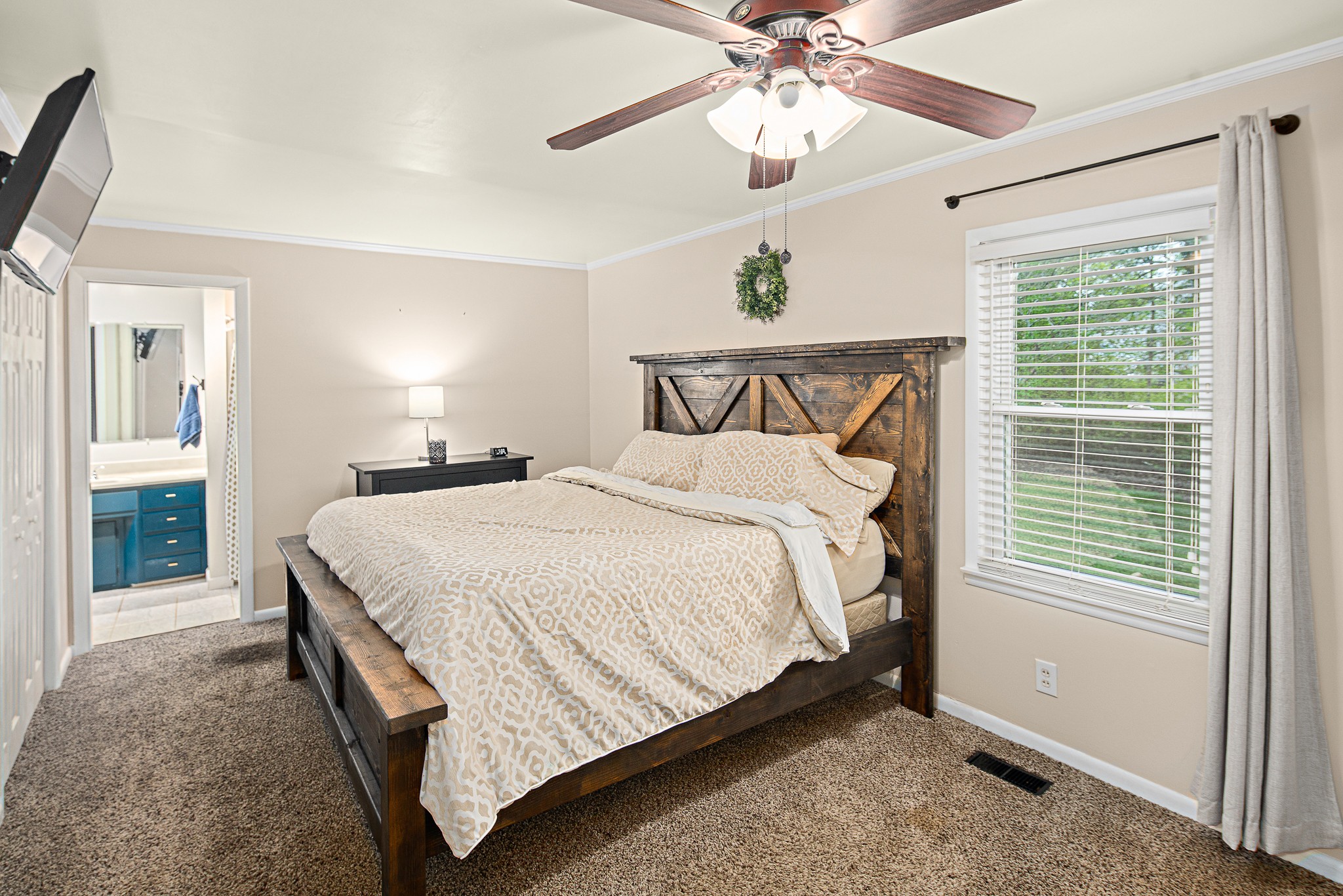 9161 Versailles Road Rockvale, TN 37153 - Photo 18 of 32 a bed sitting in a spacious bedroom next to a window