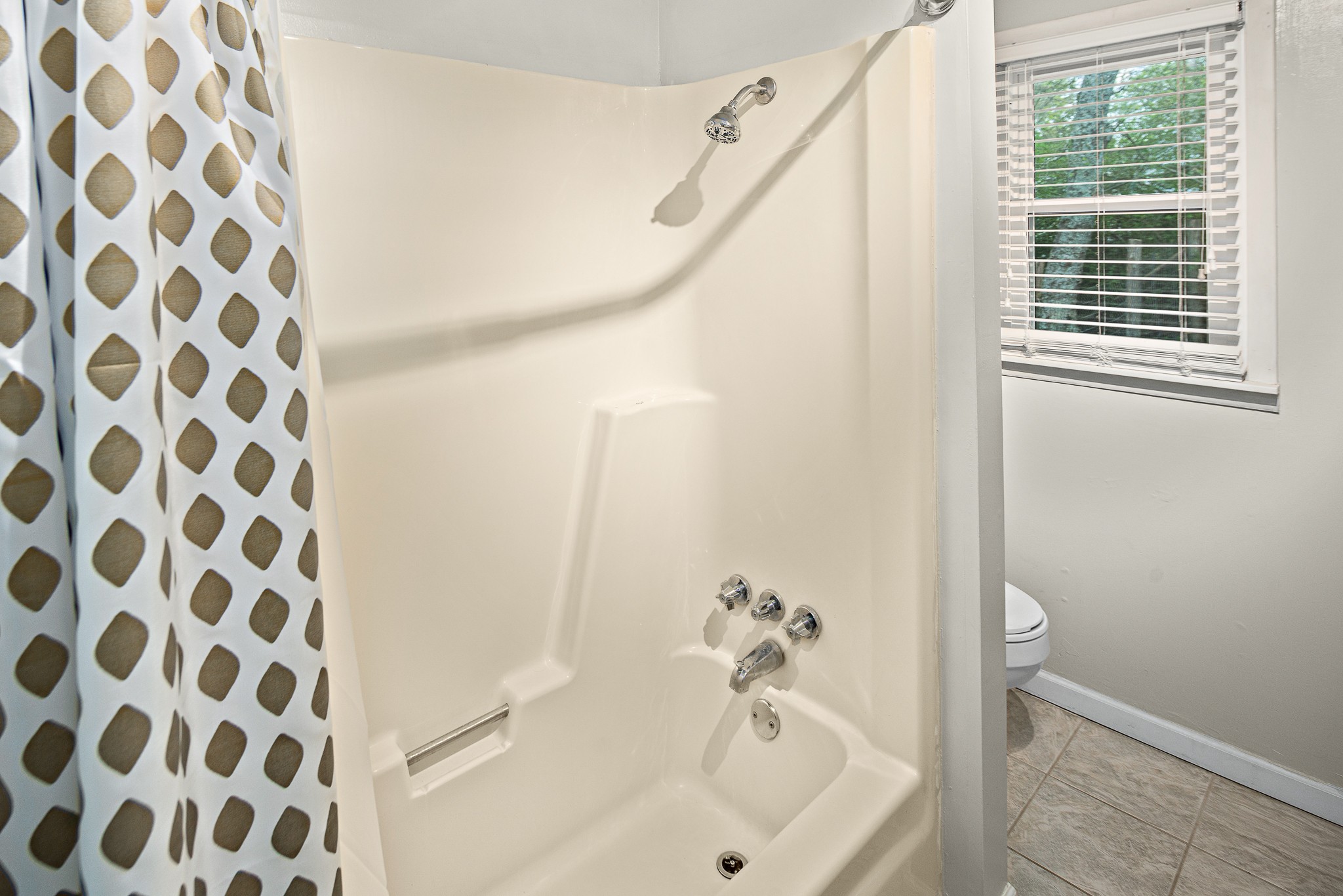 9161 Versailles Road Rockvale, TN 37153 - Photo 20 of 32 a bathroom with a bathtub and shower