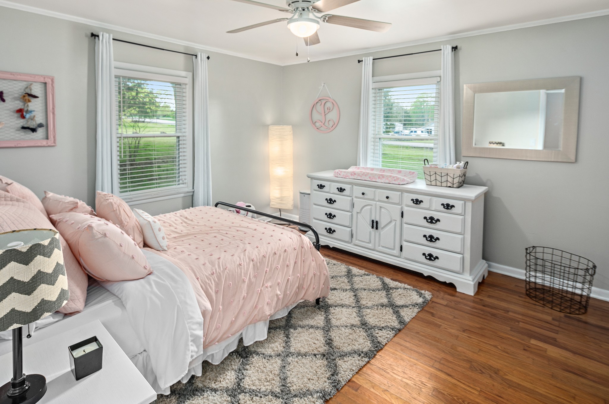9161 Versailles Road Rockvale, TN 37153 - Photo 21 of 32 a bedroom with a bed a dresser and a window