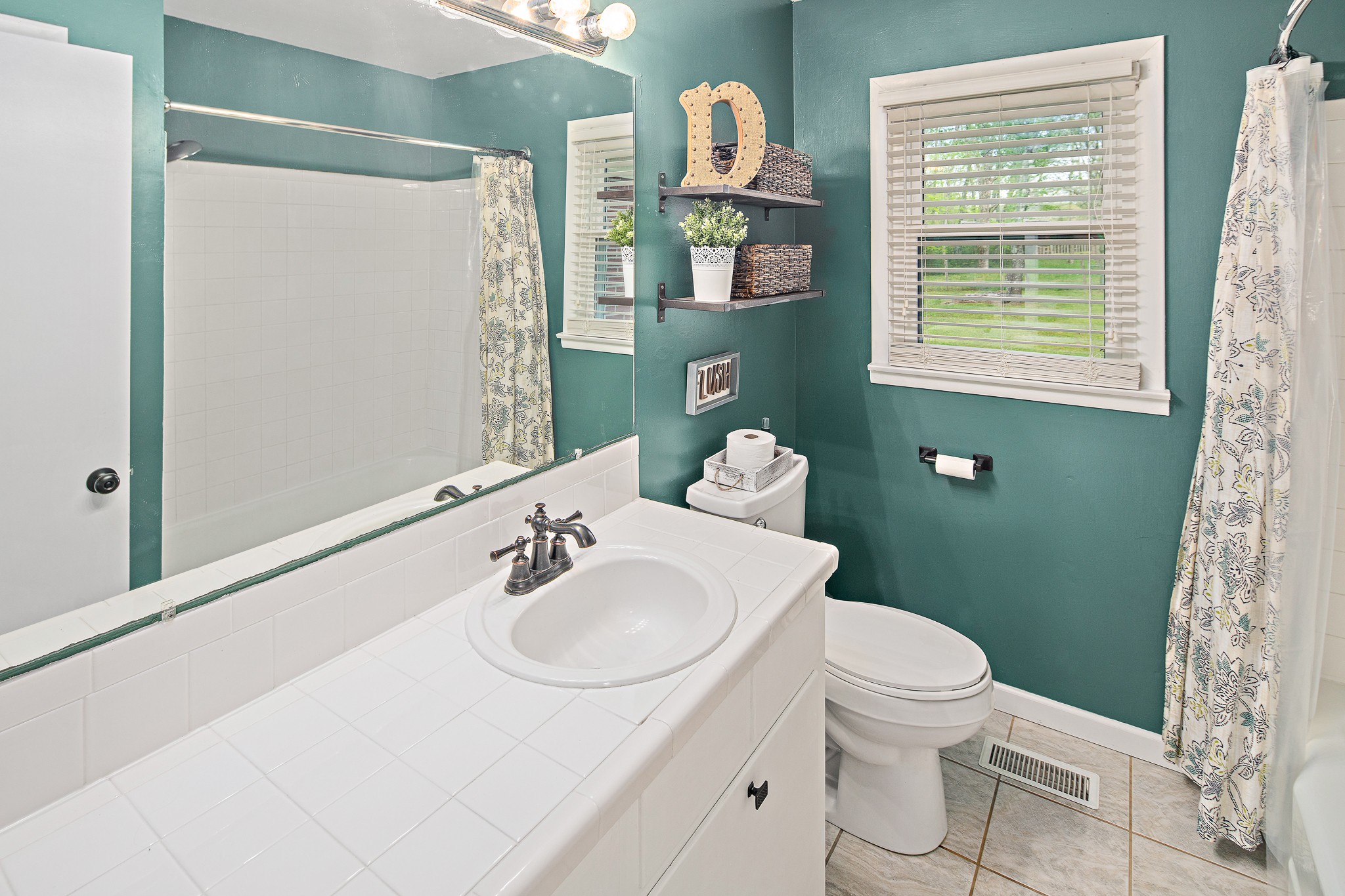 9161 Versailles Road Rockvale, TN 37153 - Photo 23 of 32 a bathroom with a sink toilet and mirror