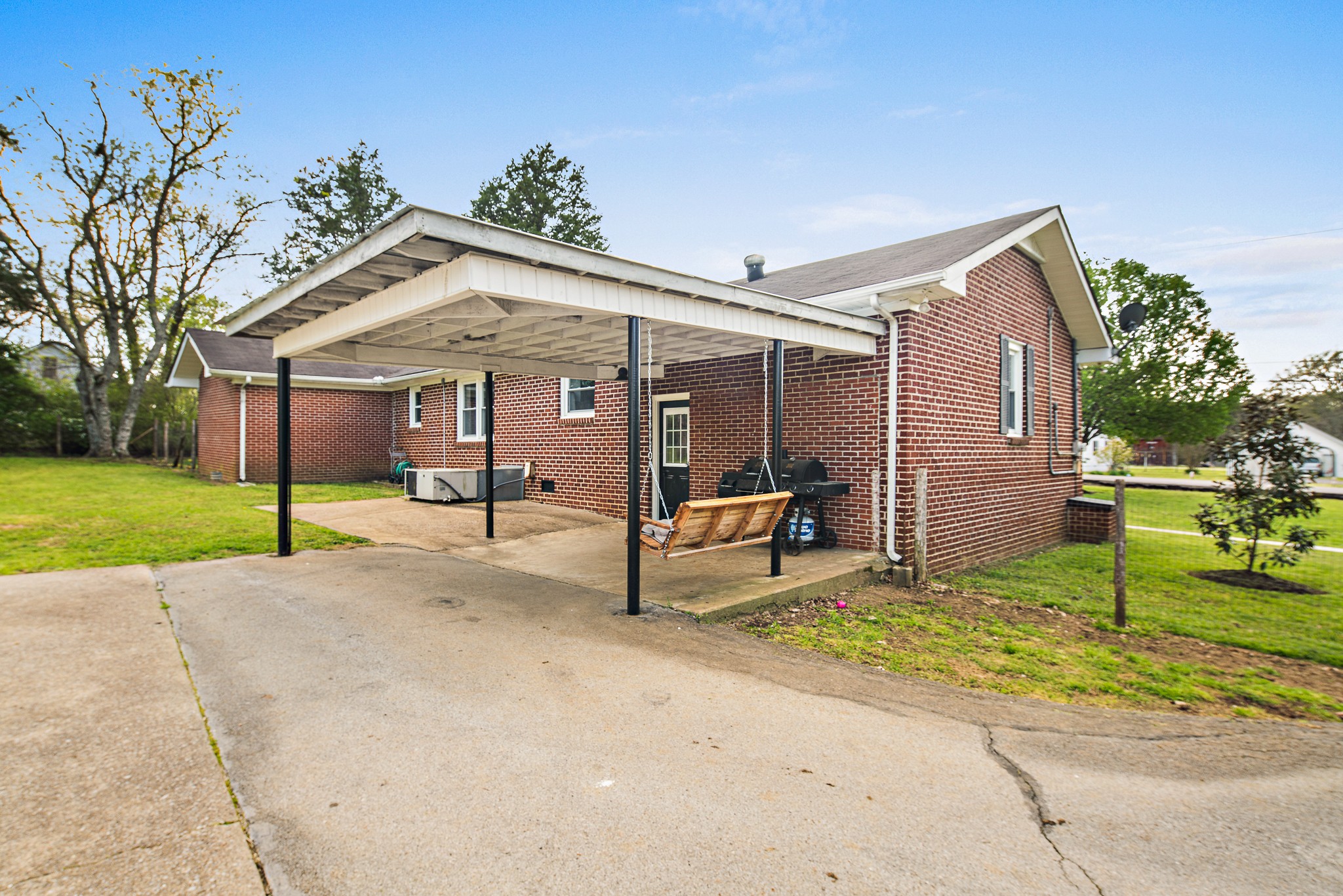 9161 Versailles Road Rockvale, TN 37153 - Photo 27 of 32 a view of a house with a yard and sitting area