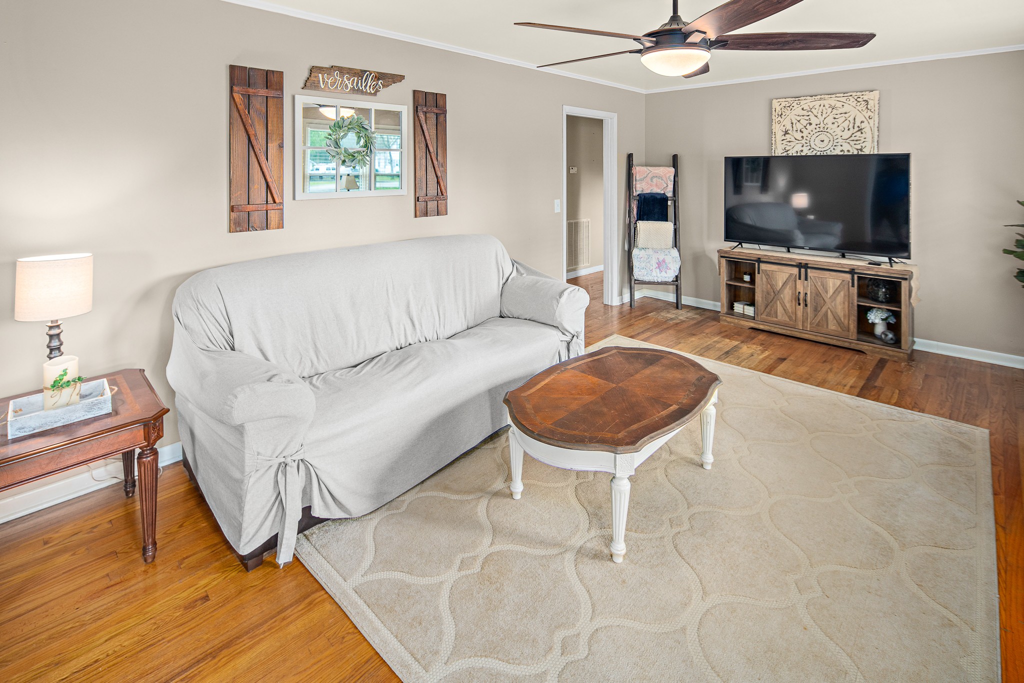 9161 Versailles Road Rockvale, TN 37153 - Photo 6 of 32 a living room with furniture and a flat screen tv