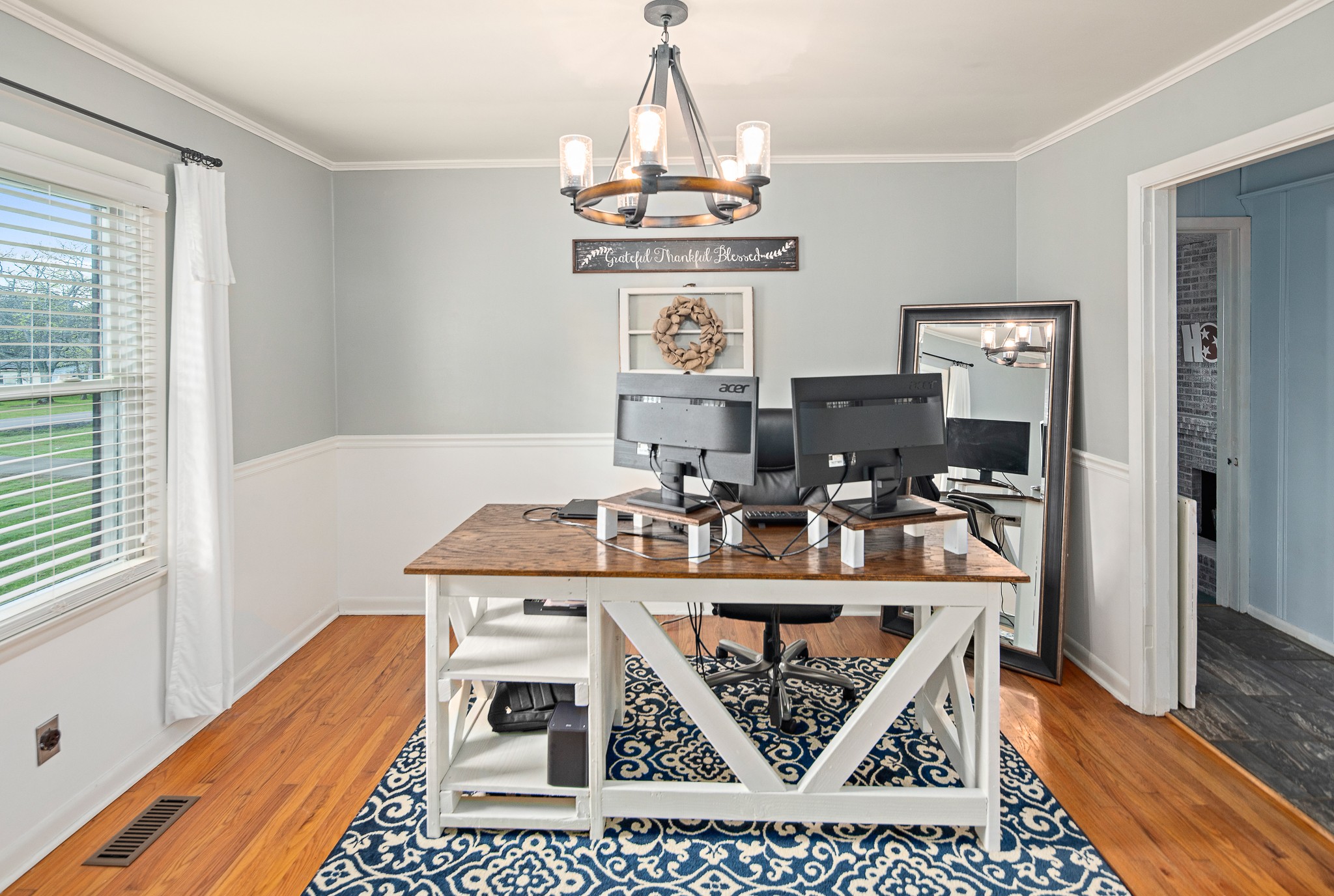 9161 Versailles Road Rockvale, TN 37153 - Photo 9 of 32 a view of a workspace with furniture and wooden floor